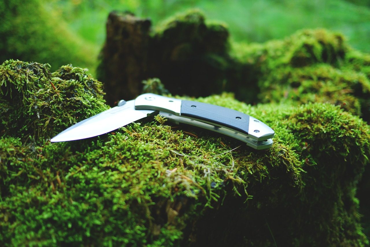 knife laying in forest cinematic - practical knife