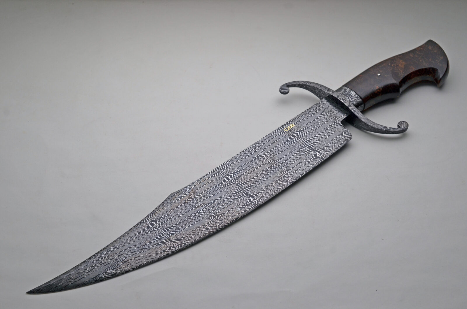 CAS large Damascus fighter with a stabilised wood handle and Damascus double guard